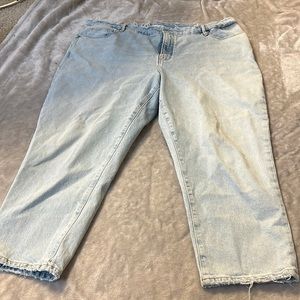 Good American cropped distressed light wash jeans